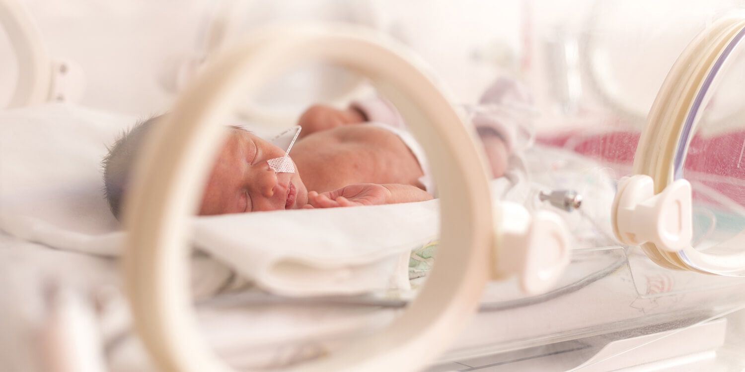 Premature baby in an incubator in hospital